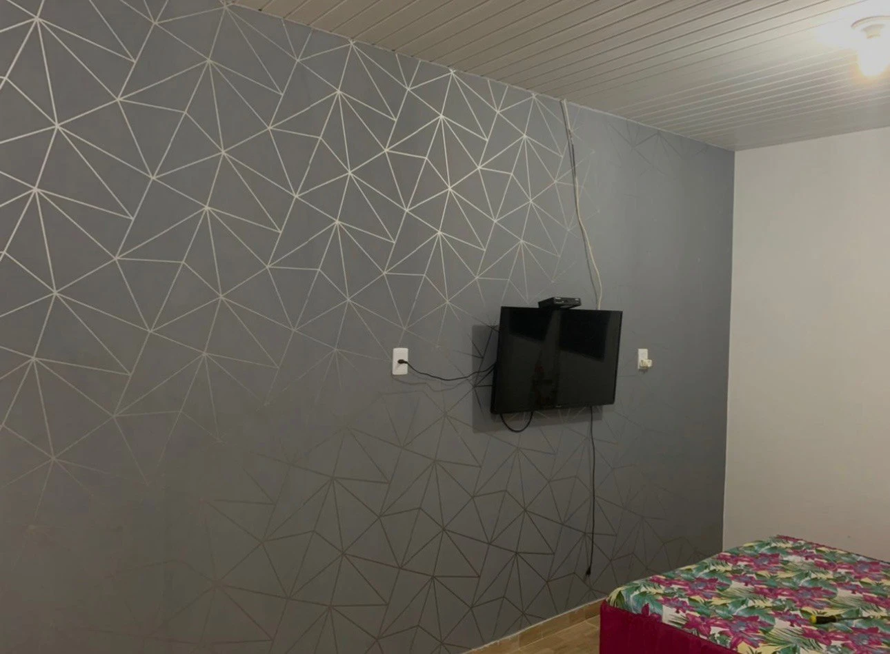 Textured wallpaper feature wall in Los Angeles apartment